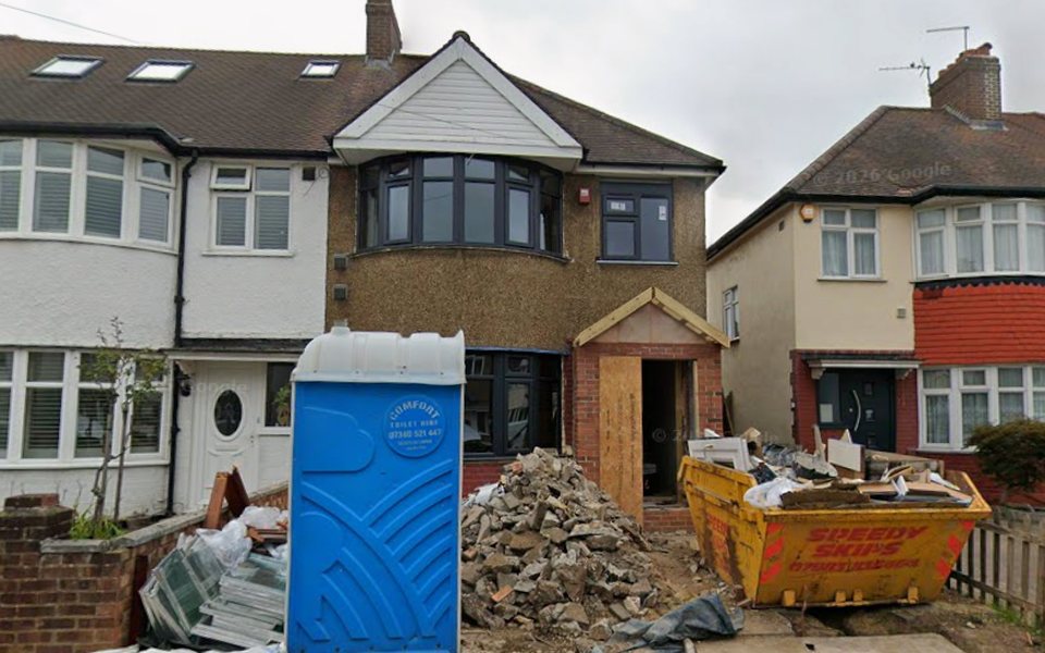 Single-storey rear extension under construction at 110 Elmer Gardens, Isleworth, with skip and building materials on site